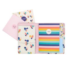 three colorful notebooks with hearts on them