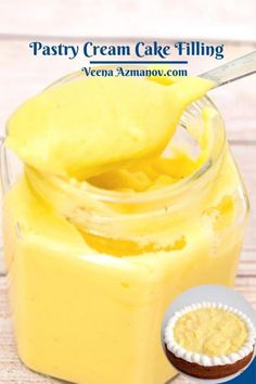 a jar filled with yellow cake filling next to a cupcake