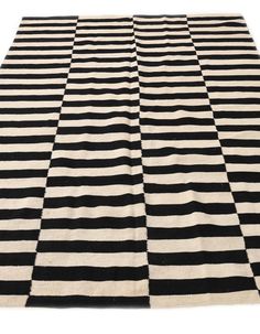 a black and white rug with stripes on it