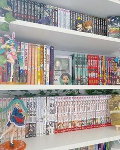 a book shelf filled with lots of children's books on top of white shelves