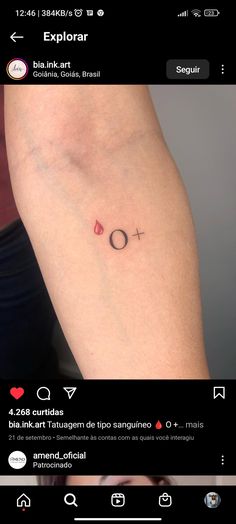 a small tattoo on the arm that says love is in the air and has an arrow