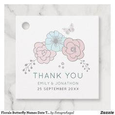 a thank card with pink and blue flowers on the front, and a butterfly in the back