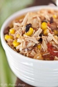 a white bowl filled with chicken and corn soup