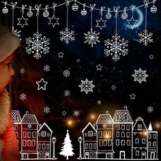 a child looking out the window at snowflakes and christmas lights in the night sky