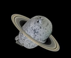 an object that looks like saturn is floating in the air with it's rings around it