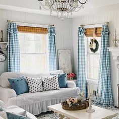 a living room filled with furniture and a chandelier