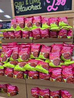 bags of chips and lime flavored hot dogs are on display in a grocery store