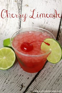 the drink is garnished with cherries and limes