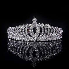 a tiara is shown on a black surface