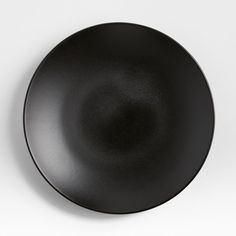 an empty black plate on a white background