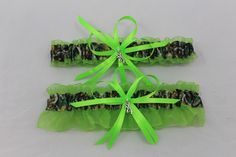 This is a pair of beautiful new handcrafted wedding garters. One keepsake garter and one toss garter. Each garter measures approx. 15" and stretches to approx. 26". Garters are made with mossy oak camouflage ribbon and lime green organza ribbon. The small bow trim ribbons are neon green. A-5 Camo Wedding Ideas, Camouflage Wedding, Prom Garters, Camo Wedding, Wedding Garter Set, Wedding Garters, Bridal Garter, Wedding Garter, Garter Set