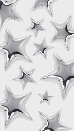 many shiny silver stars on a white background