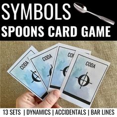 the symbols for spoons card game are displayed in front of a table with utensils