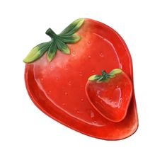 a red strawberry shaped dish with two green leaves on it's side and one large, shiny piece of fruit in the shape of a heart