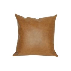 a brown leather pillow on a white background