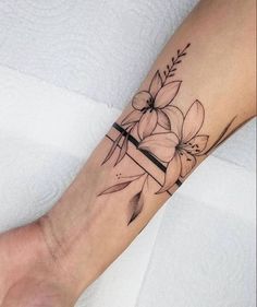 a woman's foot with a flower tattoo on it