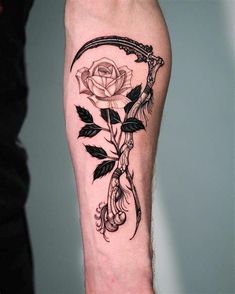 a black and white photo of a rose with an arrow on it's leg