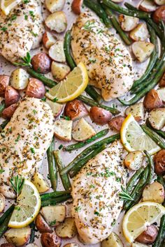 chicken, potatoes and asparagus on a sheet pan with lemons for garnish