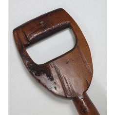 a wooden handle with holes in it