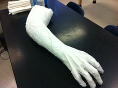 a large white glove sitting on top of a table