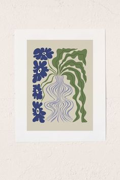 a blue and green flower print hanging on a wall