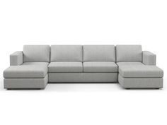 a gray sectional couch sitting on top of a white floor