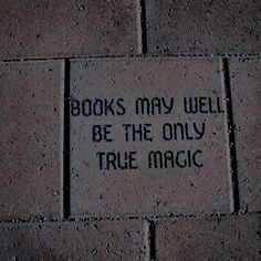 a brick sidewalk with writing on it that says books may well be the only true magic