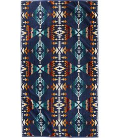 a blue and orange rug with an abstract design on the front, in different colors