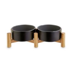 two black bowls sitting on top of each other