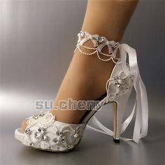 white bridal shoes with pearls and ribbons