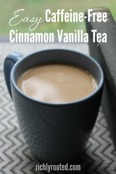 a cup of coffee sitting on top of a table next to a black box with the words easy caffeine - free cinnamon vanilla tea