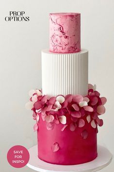 a three tiered cake with pink flowers on top and the words prop options above it
