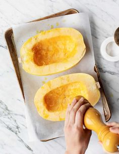 someone is peeling the inside of a squash