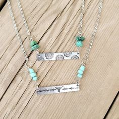 "Turquoise matches everything, making these necklaces the perfect everyday accessory. The silver bar is made of aluminum & measures 1.5\" long. Aluminum is lightweight, does not tarnish, won't turn your skin green, and is safe in water. We've added two turquoise options to the necklace: natural turquoise stones or rounded turquoise colored beads. The chain is made of stainless steel, so it will keep its silver color, even with extended wear. The necklace measures roughly 17 inches long, but may Western Stamped Necklace, Weatern Necklaces, Western Bar Necklace, Western Metal Stamped Jewelry, Western Stamped Jewelry, Western Jewelry Diy, Stamped Jewelry Ideas, Western Jewelry Necklace, Western Bar