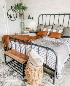 a bedroom with a metal bed frame and white walls