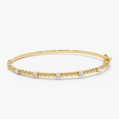 Enhance your wrist's beauty with our Diamond Bracelet Bangle, a striking piece featuring 14K Gold Beaded detail and a minimalist design. This Gold Layering Bracelet adds a touch of elegance to your ensemble, perfect for stacking or wearing alone. Explore the allure of our Minimalist Beaded Diamond Bracelet, an exquisite and thoughtful gift idea that radiates timeless charm. ▶ Item Details * Made to Order.  * Gold Kt: 14K Solid Gold (also available in 18K upon request) * Custom Gold Color: Rose Gold, Yellow Gold, White Gold * Round Diamonds: 7 Pcs 2.3 MM * Total Diamond Weight: 0.35CTW * Ready to Ship in 3-10 Business Days ▶ See more of our Gold Bangle - http://etsy.me/2l9VKBr ▶ See our storefront here - http://etsy.me/2lUcVnH  ▶ All store sections here * Diamond Rings - http://etsy.me/2lwK Yellow Gold Bangle Beaded Bracelets In Fine Jewelry, Yellow Gold Bangle Beaded Bracelets, Fine Jewelry, Classic Yellow Gold Beaded Bangle Bracelets, Yellow Gold Bangle Beaded Bracelets, Formal Round Hand-strung Bracelets, Elegant 14k Gold Hand-strung Bracelet, Modern Yellow Gold Bracelets With Round Beads, Elegant Hand-strung 14k Gold Bracelet, Formal Fine Jewelry Beaded Bangle Bracelet