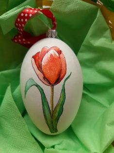 an ornament with a flower painted on it