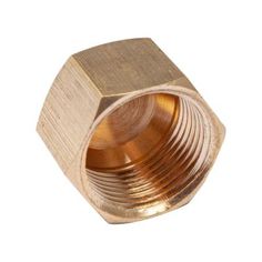 an brass hex nut on a white background