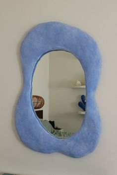 a mirror that is hanging on the wall