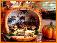 a pumpkin decorated with an image of the inside of it and some decorations on top