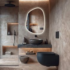 a bathroom with a round mirror above the sink and a black bowl on the counter