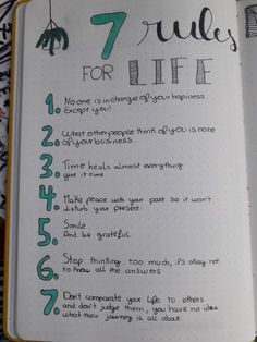 an open notebook with the words 7 rules for life written on it