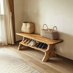 a wooden bench with shoes and baskets on it