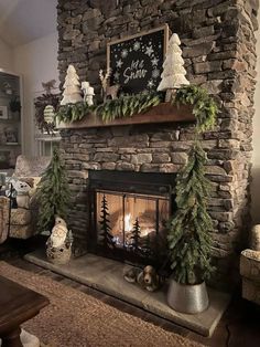 a living room with a fireplace decorated for christmas