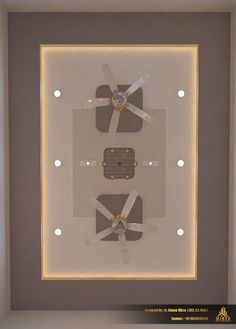 a ceiling fan mounted to the side of a wall in a room with lights around it