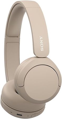 the sony headphones are beige and have buttons on them