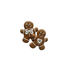 three gingerbreads with hearts and bows are shown in the shape of two people