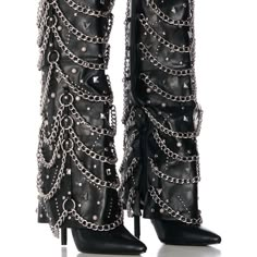 Strut Like The Whole World Is Your Runway In The Azalea Wang "Rockstar Rebel" Black Embellished Hardware Fold Over Boot. Crafted Using A Luxurious Faux Leather Upper, This Bad-To-The-Bone Style Features A Knee-High Fold Over Shaft, A Pointed Toe Silhouette, Tonal Stitching, A Slightly Covered Slim Stiletto Heel, A Comfortable Cushioned Insole, Faux Silver Metallic Hardware, A Pull-On Fit, And An Inner Ankle Zipper Closure. Complete With An Ultra-Decorated Body, Consisting Of Pointed Pyramid And Rockstar Boots, Concert Shoes, Cover Boots, Silver Stilettos, Glam Boots, Embellished Boots, Crazy Heels, Odd Fashion, Distressed Knit