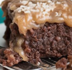 a close up of a piece of cake on a plate with a fork in it