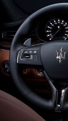 the steering wheel and dashboard of a car